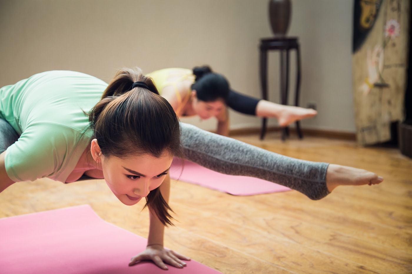 Yoga workshop with students in an arm balance